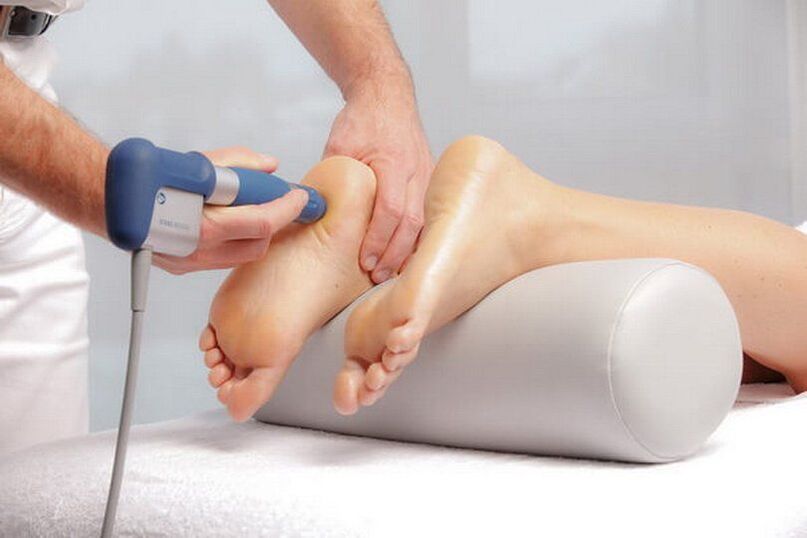 Performing shock wave therapy.